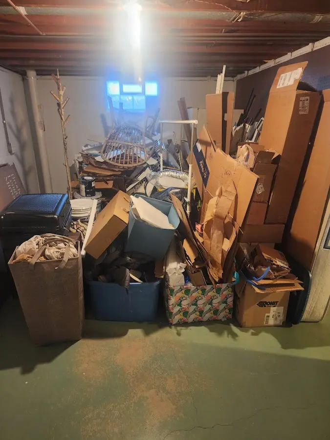 Roll-off dumpster container at job site for 4 Yard Dumpster Rental in Jericho