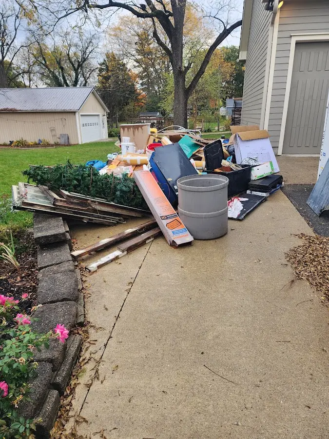 Dumpster being loaded with debris for 3 Yard Dumpster Rental in Jericho